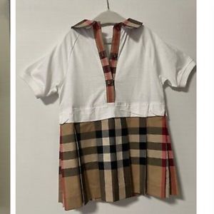 This classic plaid Burberry dress is perfect for your little girl